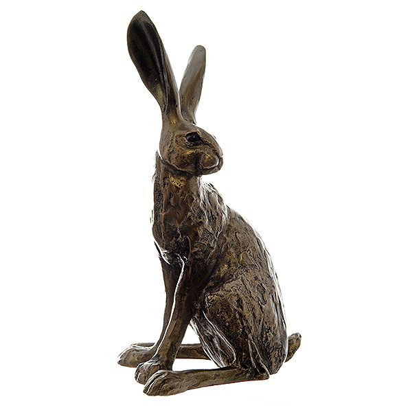 A sculpted bronze resin hare, sitting upright with his ears pricked, looking over his left shoulder