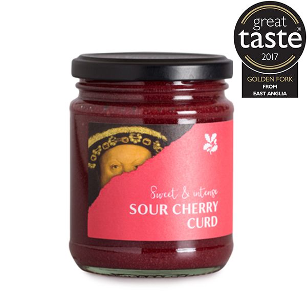 A deep red sour cherry curd in a glass jar with a black lid and a pink National Trust label