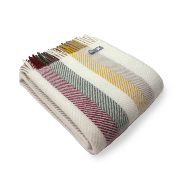 Three quarter view of the Vintage Fishbone Stripe throw folded up, with multicolour tassels on the left side.