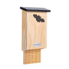 Wooden bat box on a plain white background. The bat box features a National Trust metal logo on the front and a bat silhouette cut out.