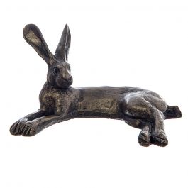 Small sculptued bronze finish hare in a curved lying position with his legs out and both ears upright