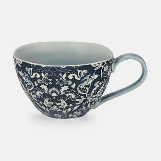 Ornate Floral Mug, Blue - image shows blue patterned porcelain mug with artisan, crafted shape on a plain grey background.