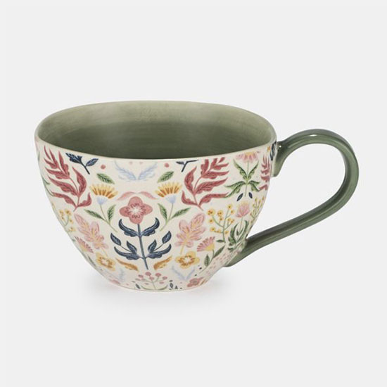 Ornate Floral Mug, Green - image shows blue patterned porcelain mug with artisan, crafted shape on a plain grey background.