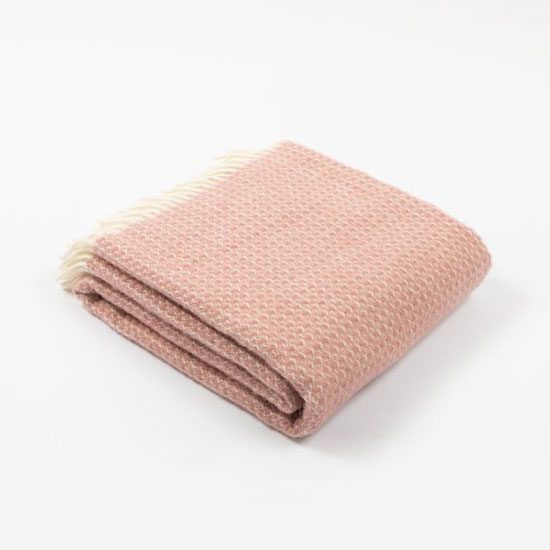 National Trust Wool Blanket, Dusky Pink - £45.00. Image shows pink wool throw with cream tassels folded on a plain, grey background. Browse the throws and blankets range for homeware that helps look after National Trust places, for everyone, for ever.