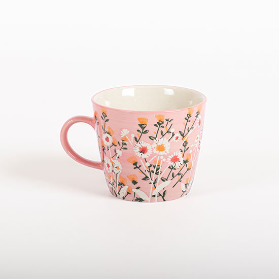 Pink Wild Daisy Stoneware Mug (£8.00) from the National Trust's new spring homeware range, perfect for both Mother's Day and Easter gifting. Image shows pink stoneware mug, decorated with white, green and yellow daisy motifs inside and out, on a plain grey background.