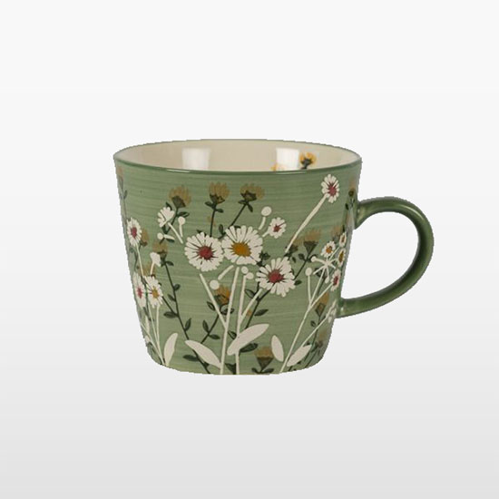 Green Daisy Mug (£8.00). Image shows mug, decorated with white and yellow daisies with a green base, on plain grey background.