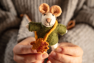 Decorative accessories - image shows George the Mouse, a hanging decoration from our autumn winter range, held in a person's hands. 